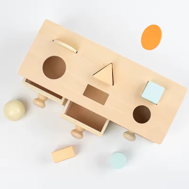 Wooden shape sorting and permanence box